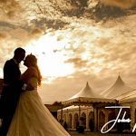 Minstrel Court Wedding Venue - Bride and Groom against a stunning Sky