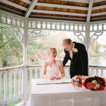 Minstrel Court lake Wedding Pavilion - Bride and Groom Signing the Register