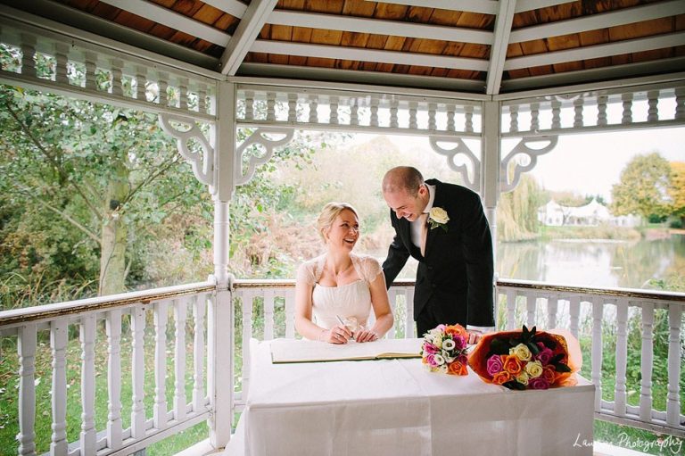 Minstrel Court lake Wedding Pavilion - Bride and Groom Signing the Register
