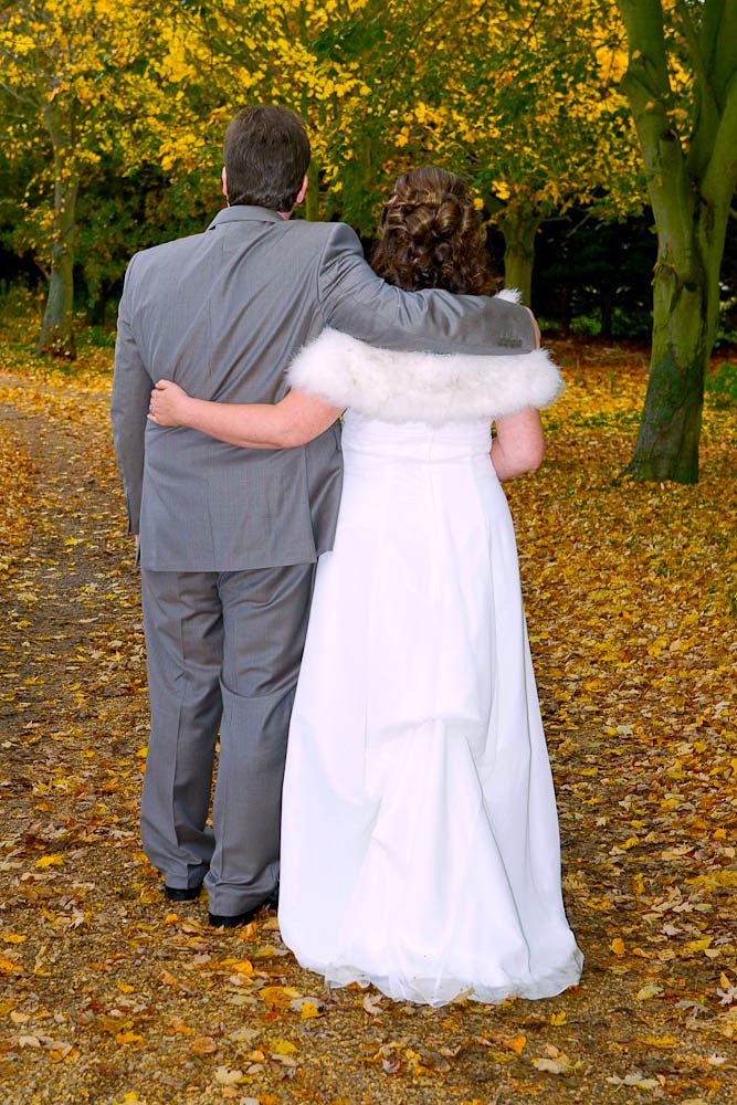 Minstrel Court Wedding - bride and groom with leaves